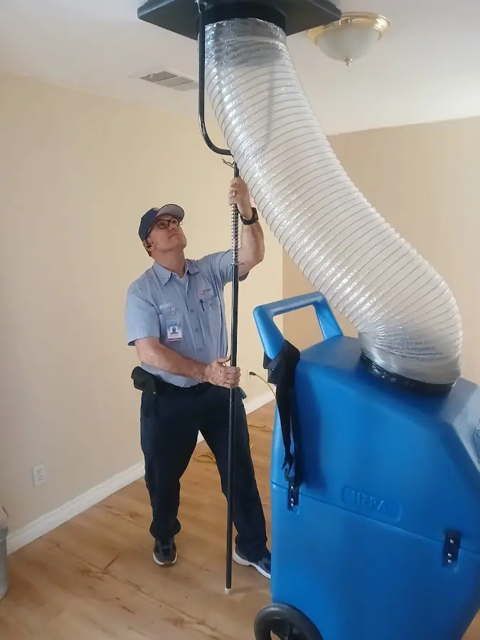 Furnace Tune-Up technician using HEPA equipment in Union City